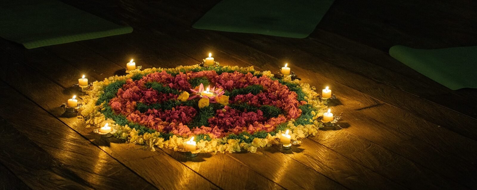 Candlelit flower mandala at a Seiiki retreat